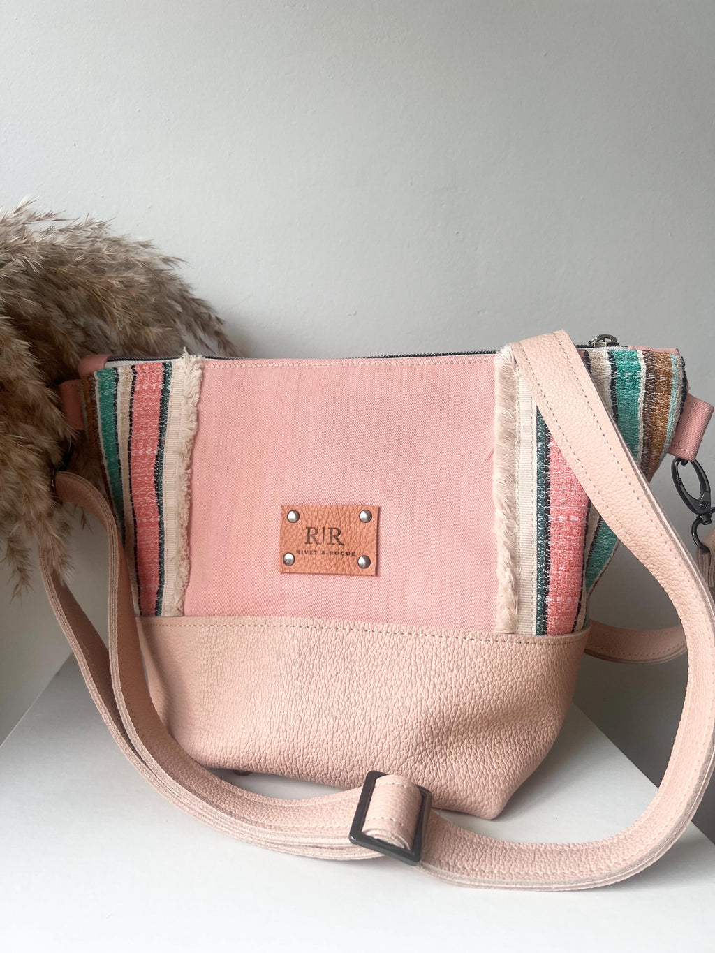 Handcrafted leather and denim cross body bag