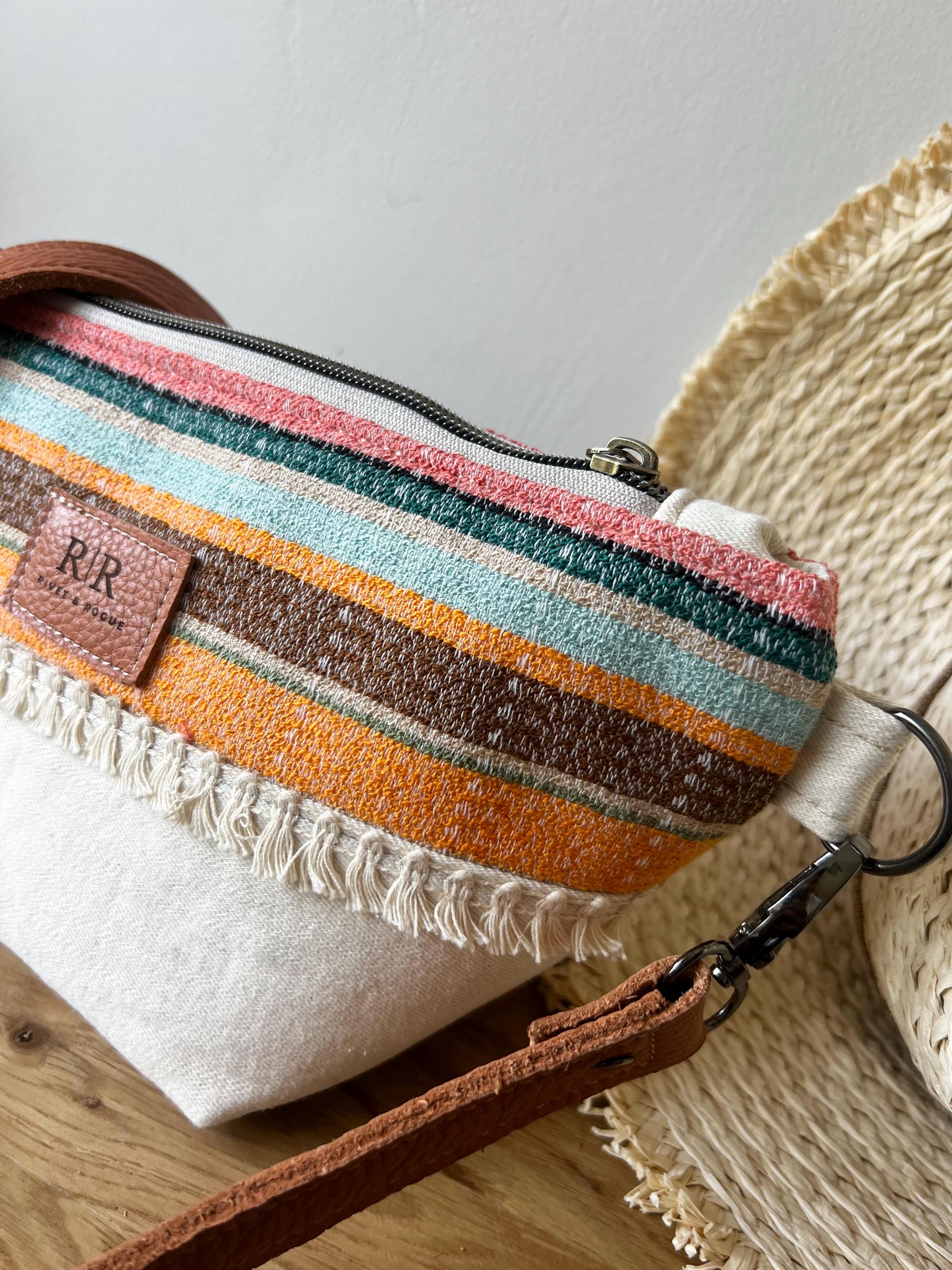 Handcrafted leather and denim cross body bag