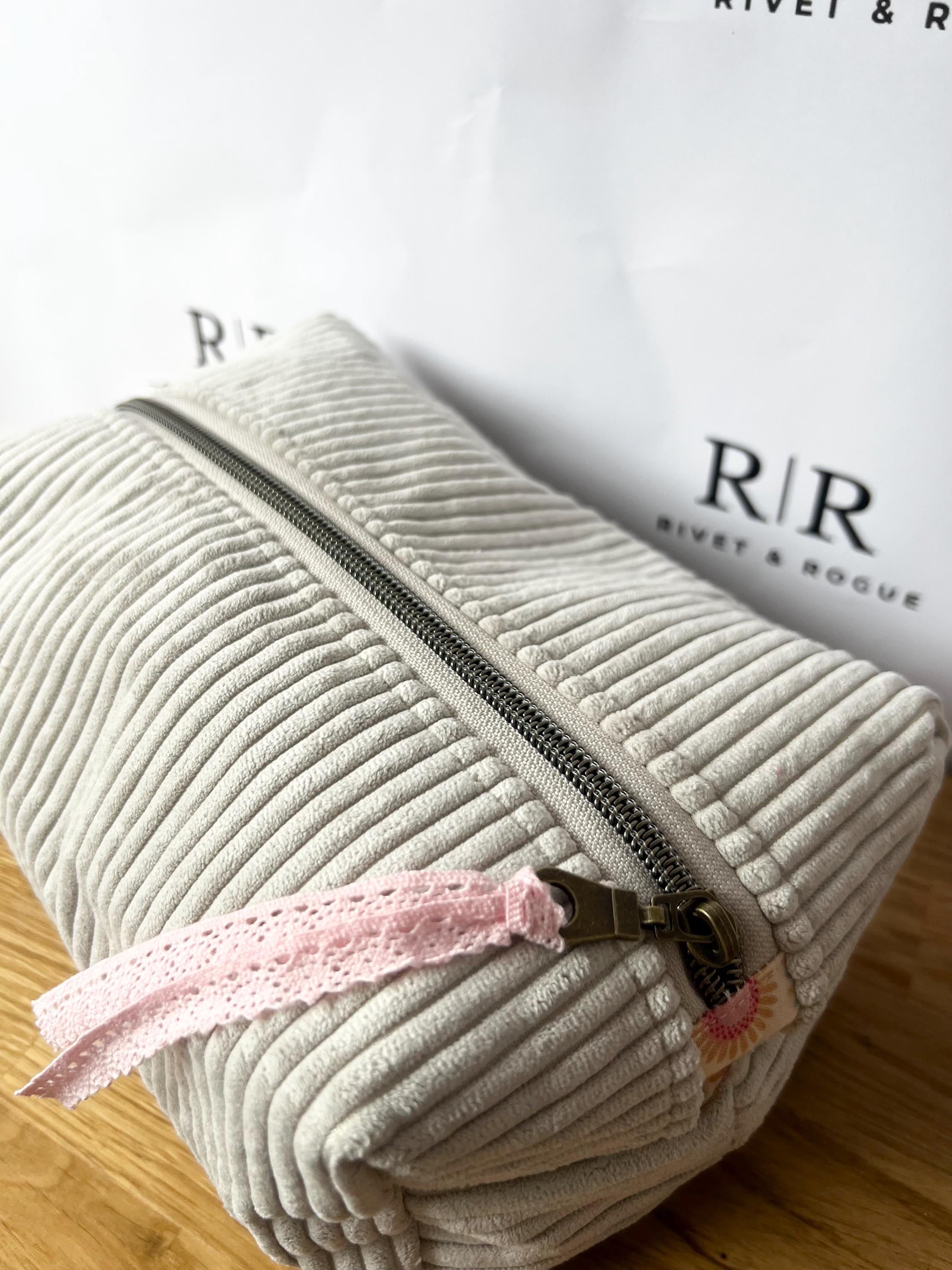 Grey jumbo cord make-up bag with contrasting Tilda lining.