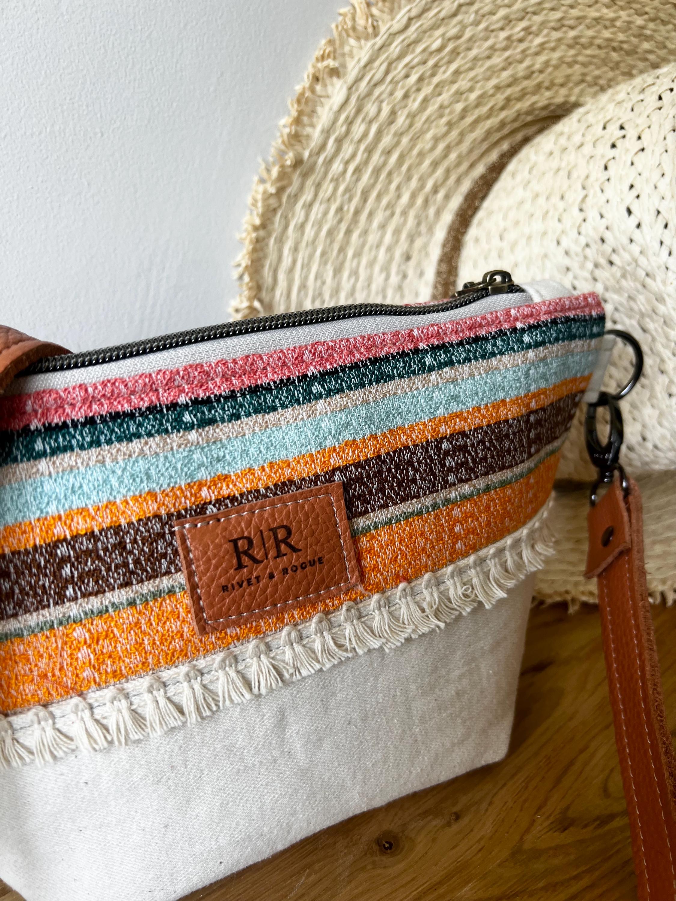 Handcrafted leather and denim cross body bag
