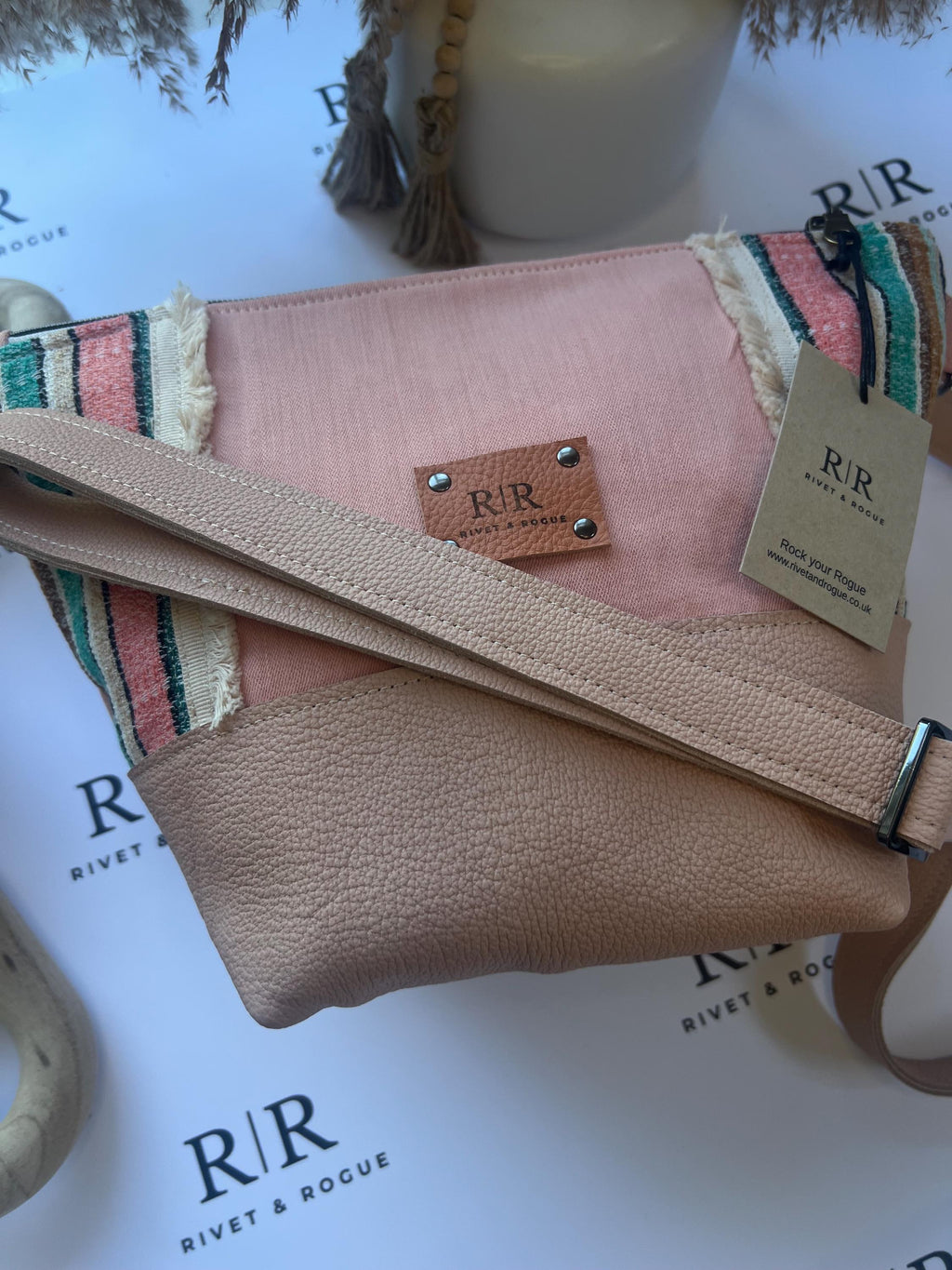Handcrafted leather and denim cross body bag