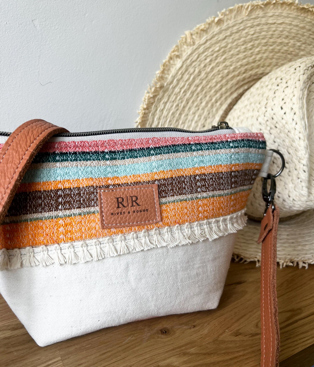 Handcrafted leather and denim cross body bag