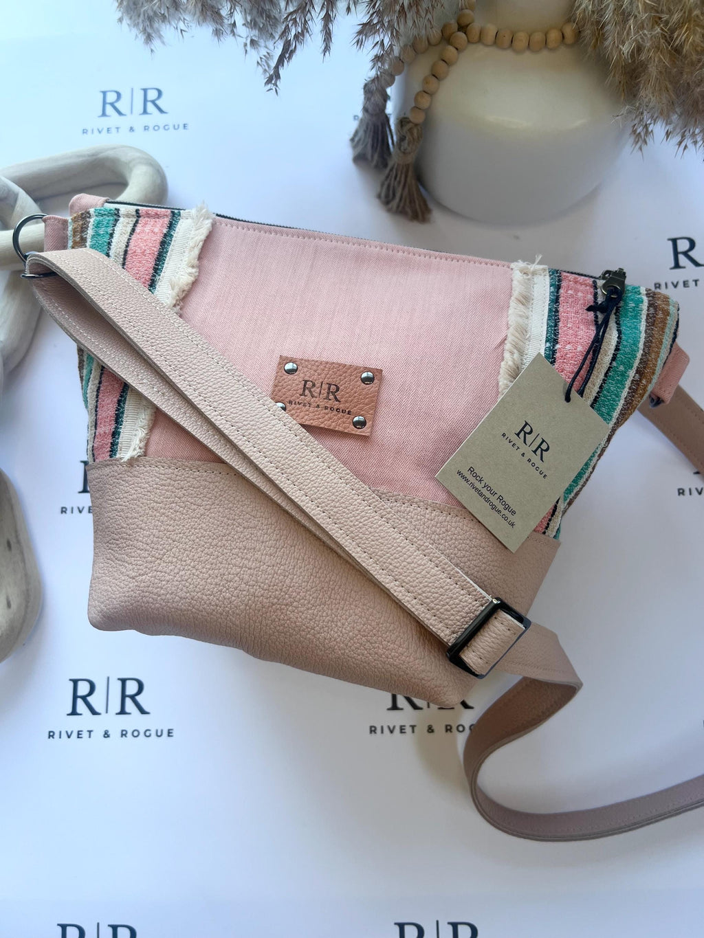 Handcrafted leather and denim cross body bag