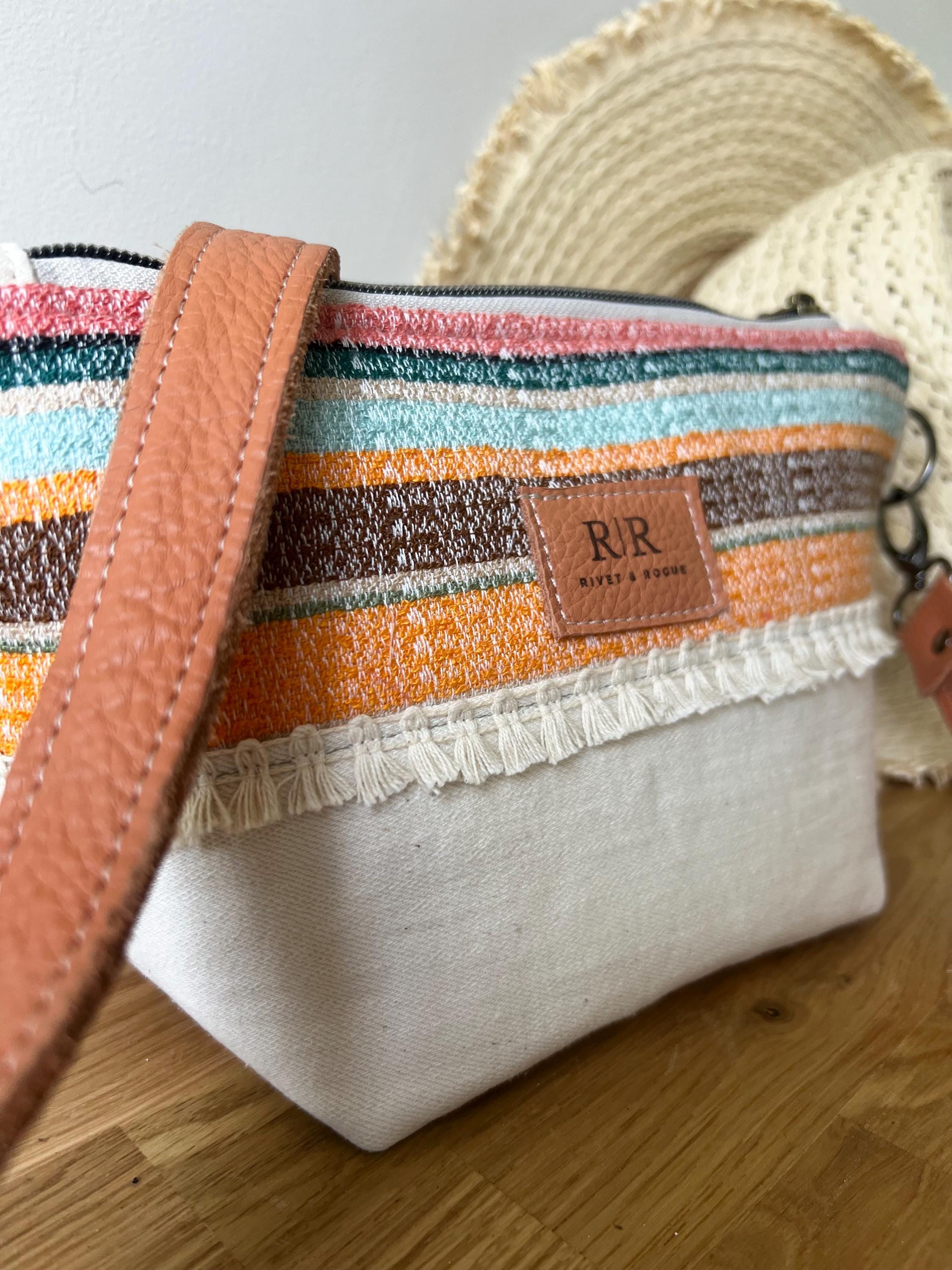 Handcrafted leather and denim cross body bag