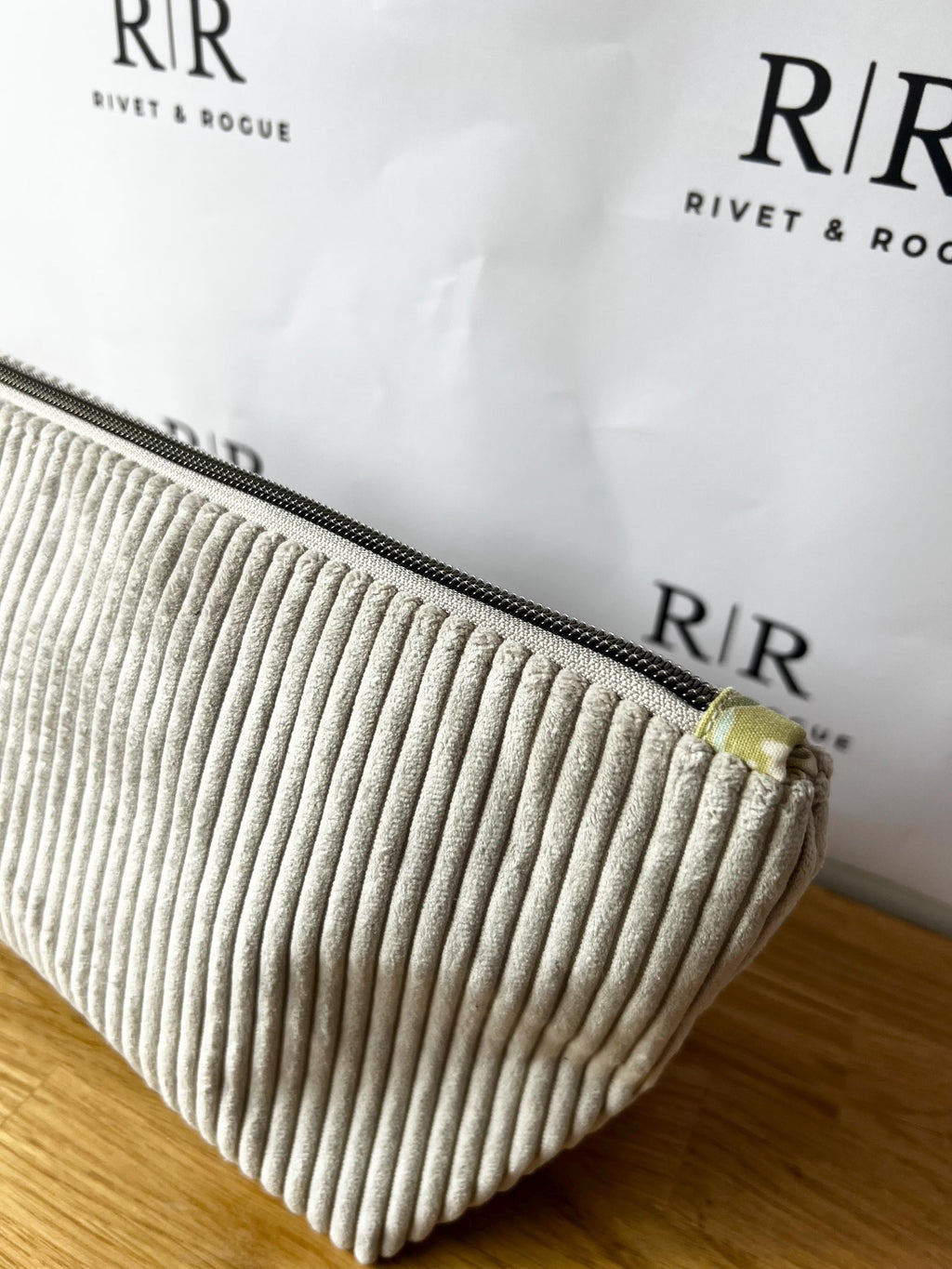 Grey jumbo cord make-up bag with contrasting Tilda lining.