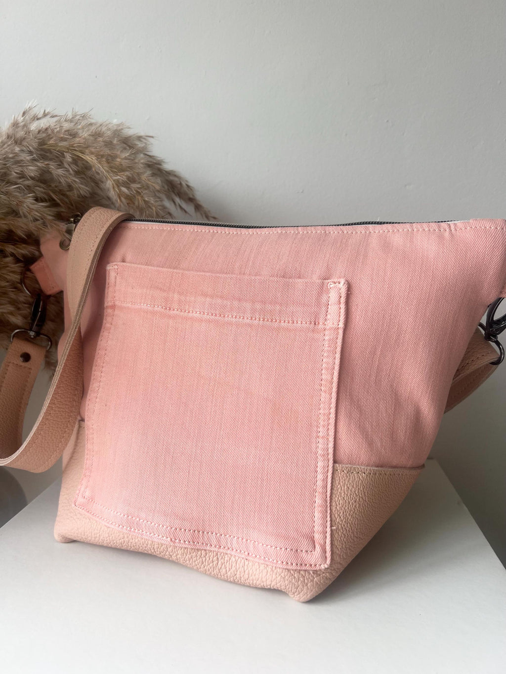 Handcrafted leather and denim cross body bag