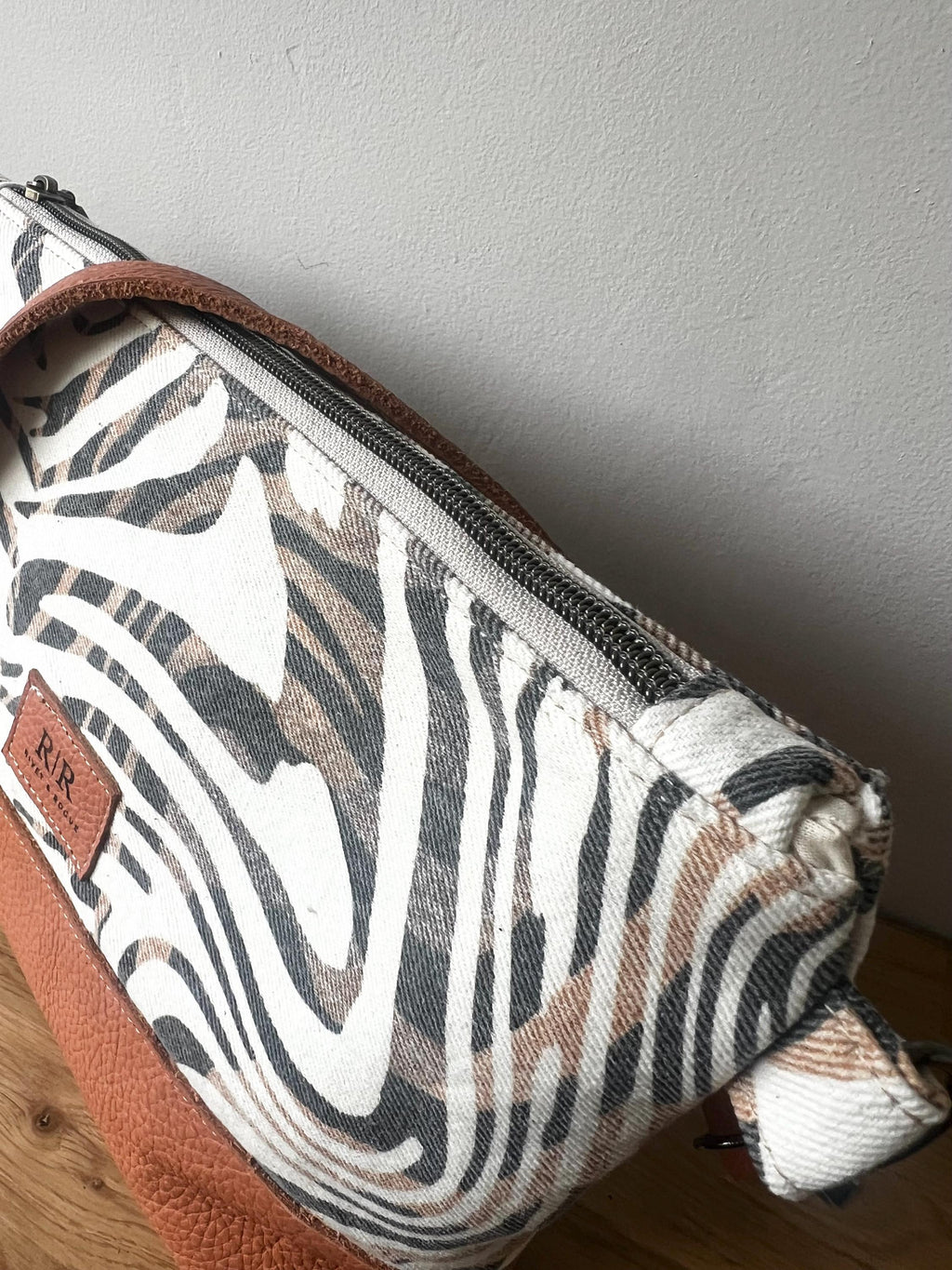 Handcrafted leather and denim cross body bag
