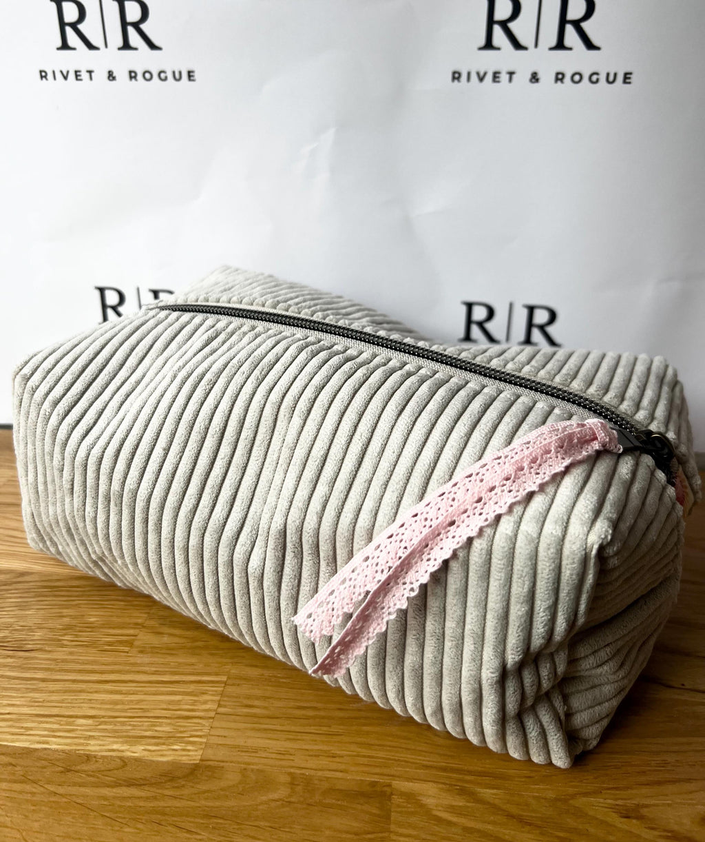 Grey jumbo cord make-up bag with contrasting Tilda lining.