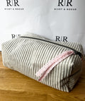Grey jumbo cord make-up bag with contrasting Tilda lining.