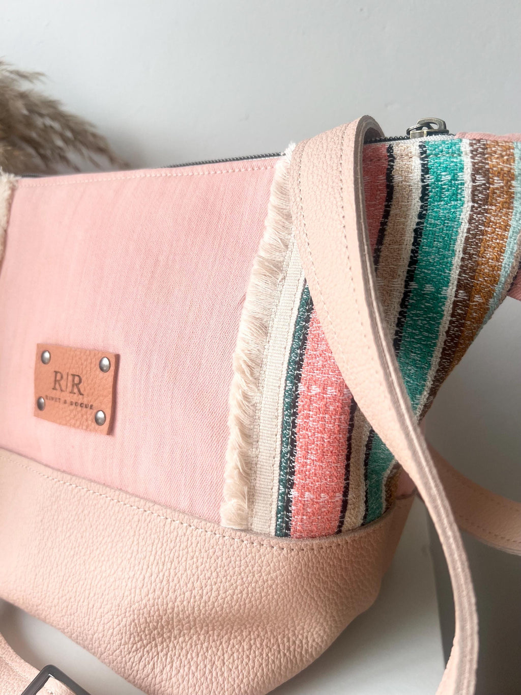 Handcrafted leather and denim cross body bag