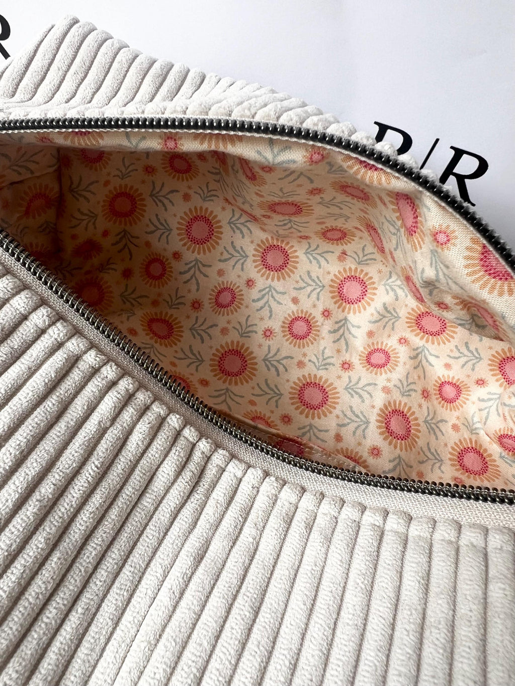 Grey jumbo cord make-up bag with contrasting Tilda lining.